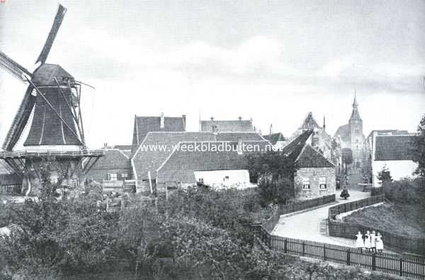 Gezicht op den ouden molen en de kerk te Hattem