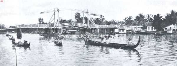 Een echt Hollandsche dubbele ophaalbrug in tropische omgeving. Brug te Bandjermassin (Borneo)