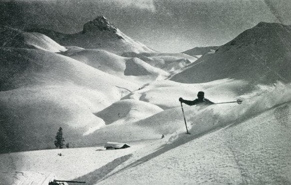 Zwitserland, 1931, Adelboden, WINTER IN DE BERGEN. OP DEN REGENBOLSHORN BIJ ADELBODEN. BERGAFWAARTS DOOR STUIVENDE SNEEUW
